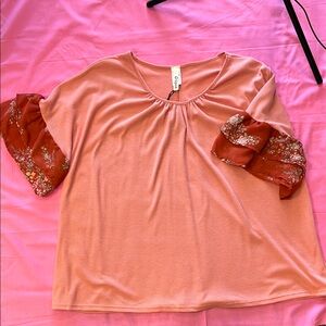 Elegant Coral Women's Top with Floral Sleeves
